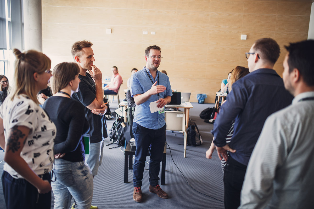 Ben running a workshop with people around him.